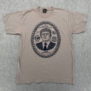 Death Traitors Donald Trump Putrid Face of Greed Skulls Graphic T-Shirt Tan L